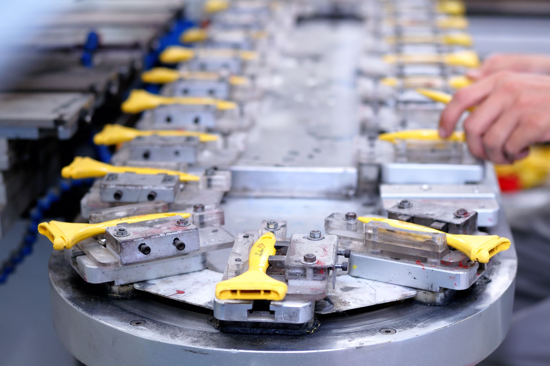 A production fixture holding multiple components during a repeatable manufacturing process